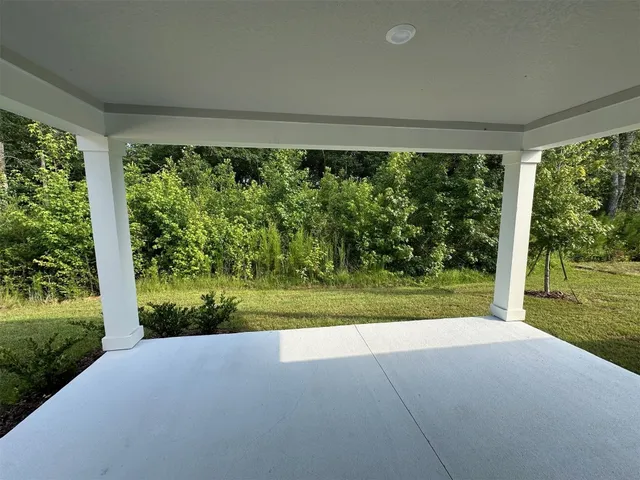 a view of a yard with an outdoor space