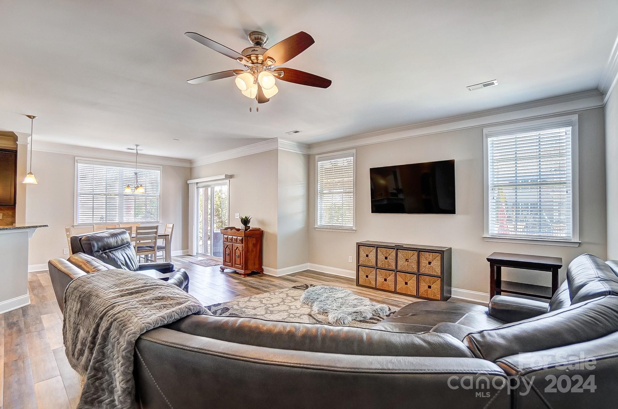 156 Annatto Way Tega Cay, SC 29708 - Photo 11 of 48 a living room with furniture and a flat screen tv