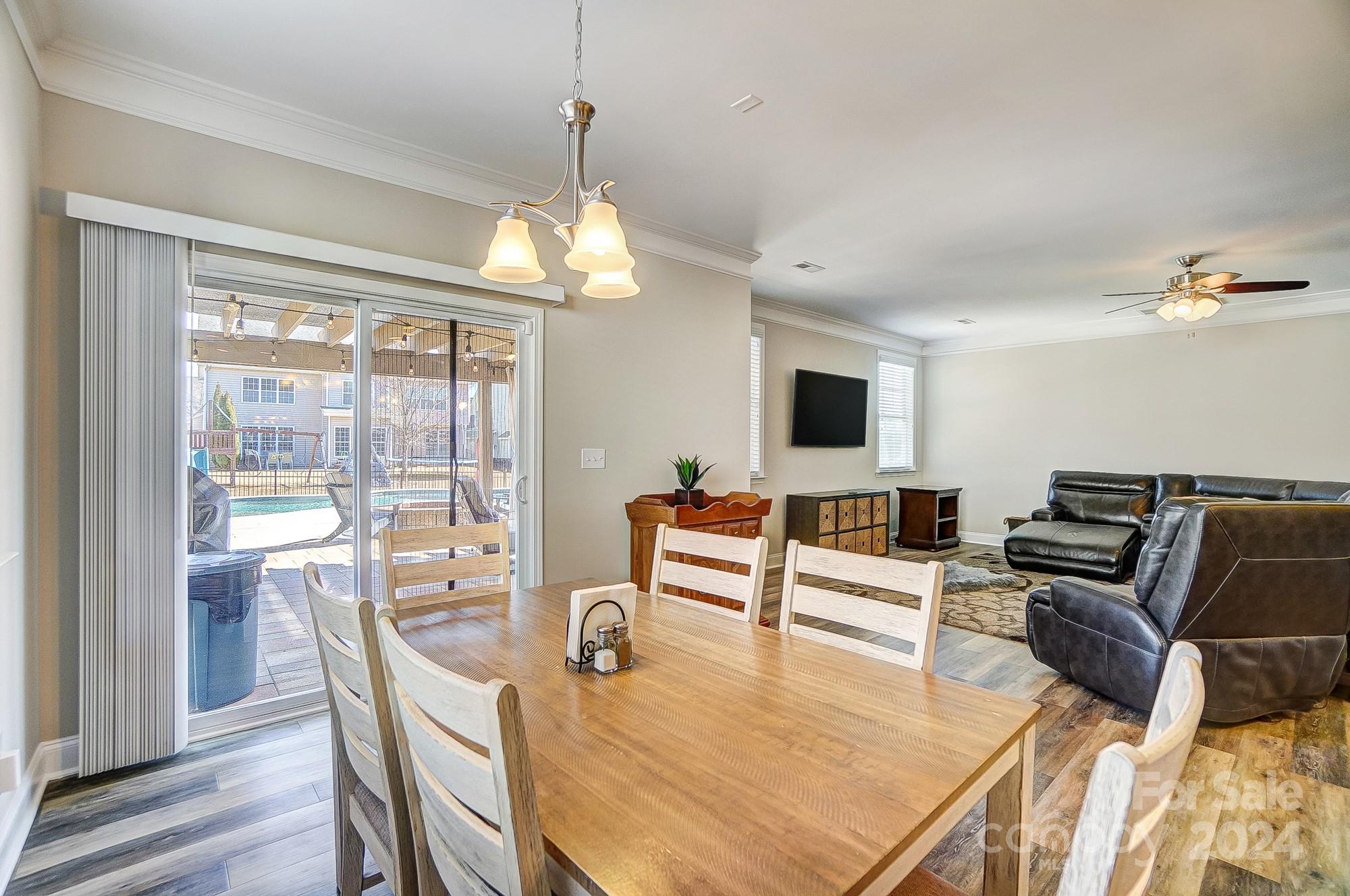 156 Annatto Way Tega Cay, SC 29708 - Photo 18 of 48 a living room with furniture flat screen tv and wooden floor