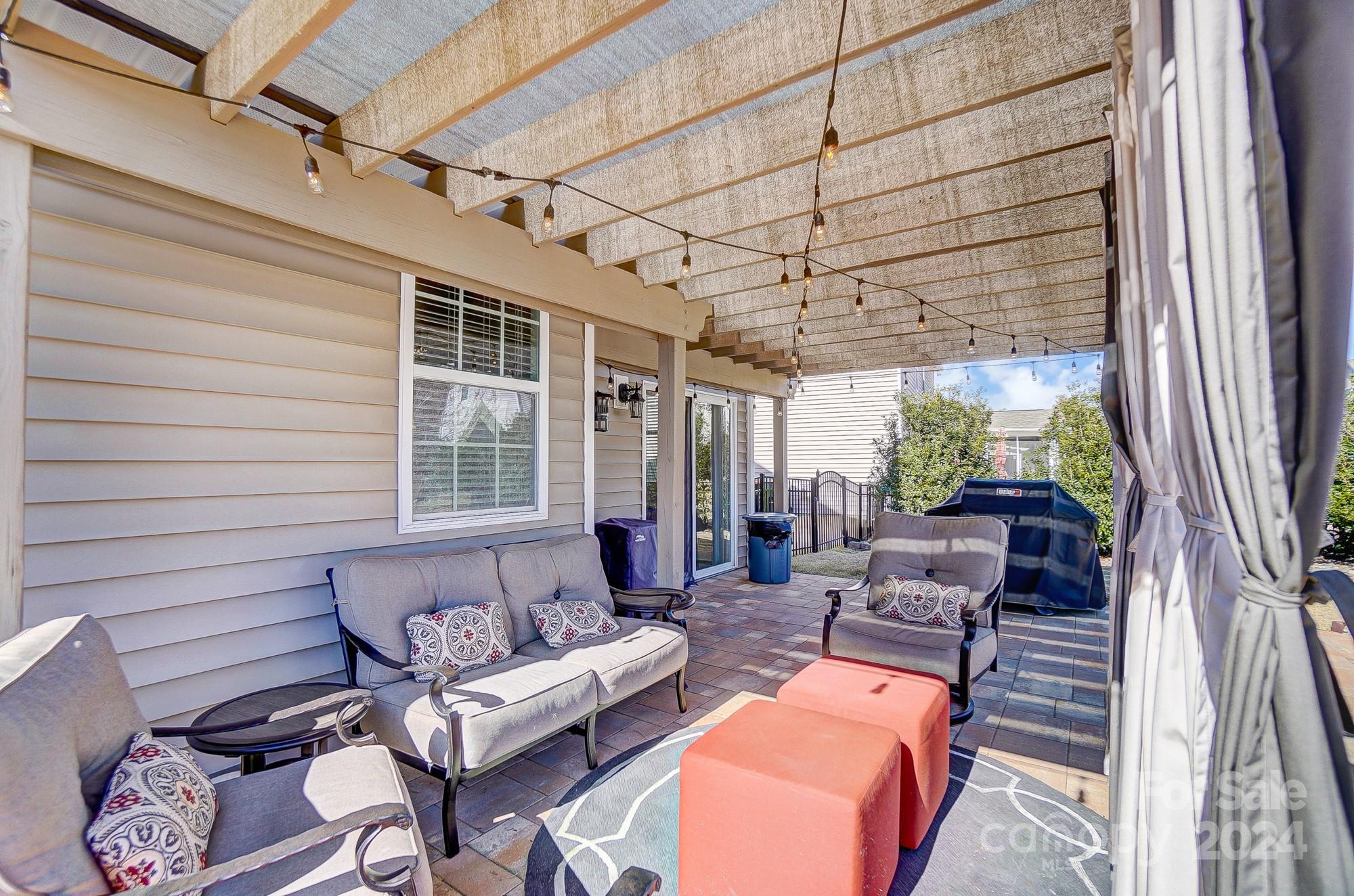 156 Annatto Way Tega Cay, SC 29708 - Photo 20 of 48 a outdoor space with patio the couches and a dining table with the balcony