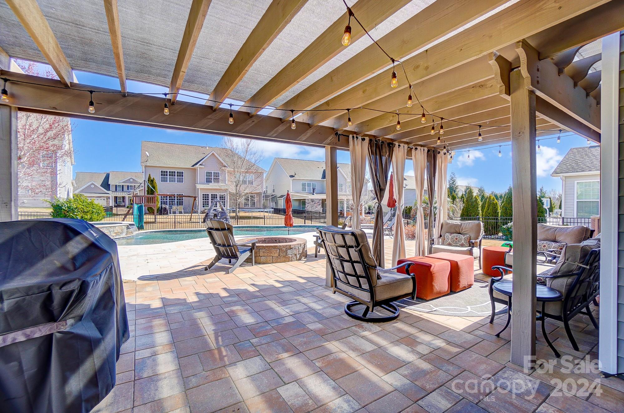 156 Annatto Way Tega Cay, SC 29708 - Photo 21 of 48 a view of a patio with a table and chairs
