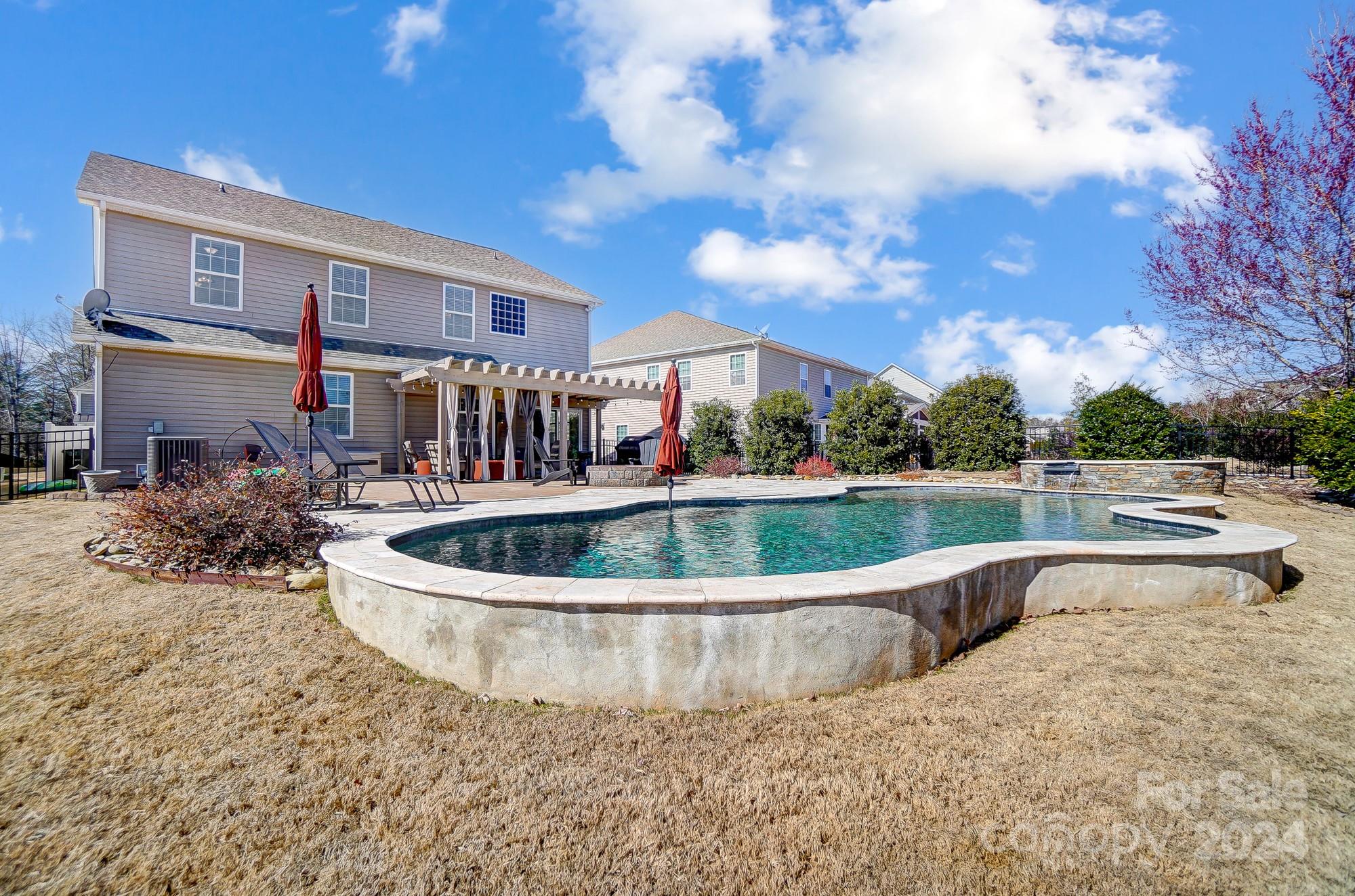 156 Annatto Way Tega Cay, SC 29708 - Photo 25 of 48 a view of a house with a swimming pool