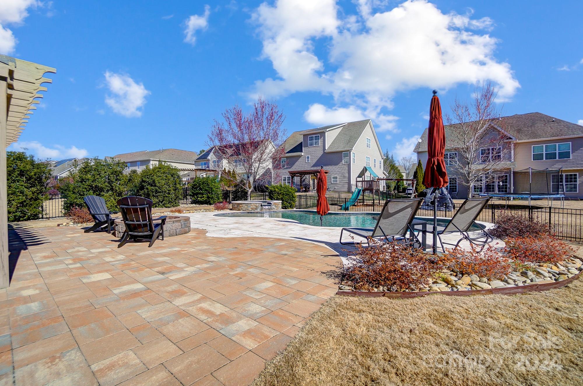 156 Annatto Way Tega Cay, SC 29708 - Photo 26 of 48 a view of patio with dining table and chairs