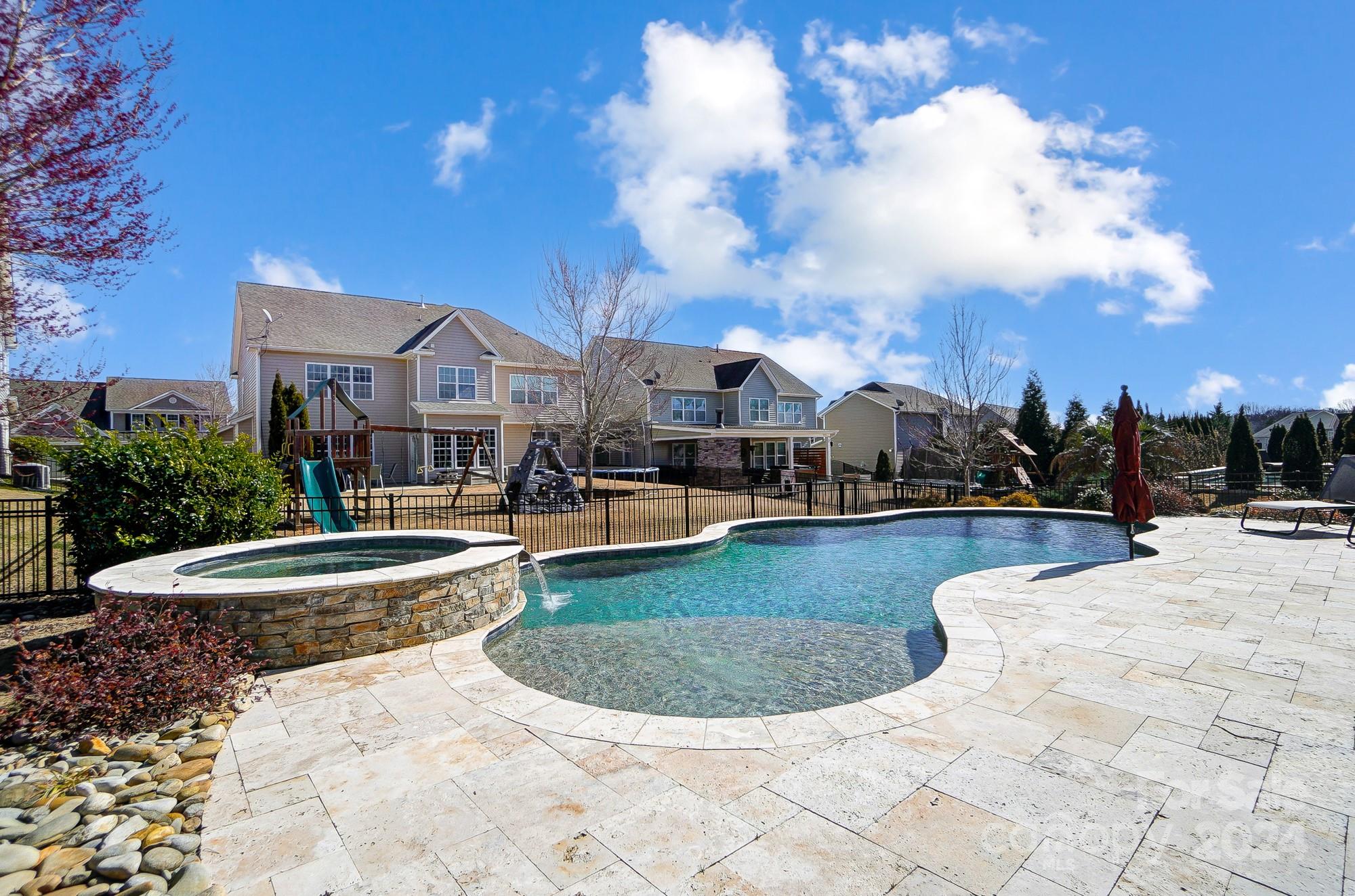 156 Annatto Way Tega Cay, SC 29708 - Photo 29 of 48 a view of a house with swimming pool and sitting area