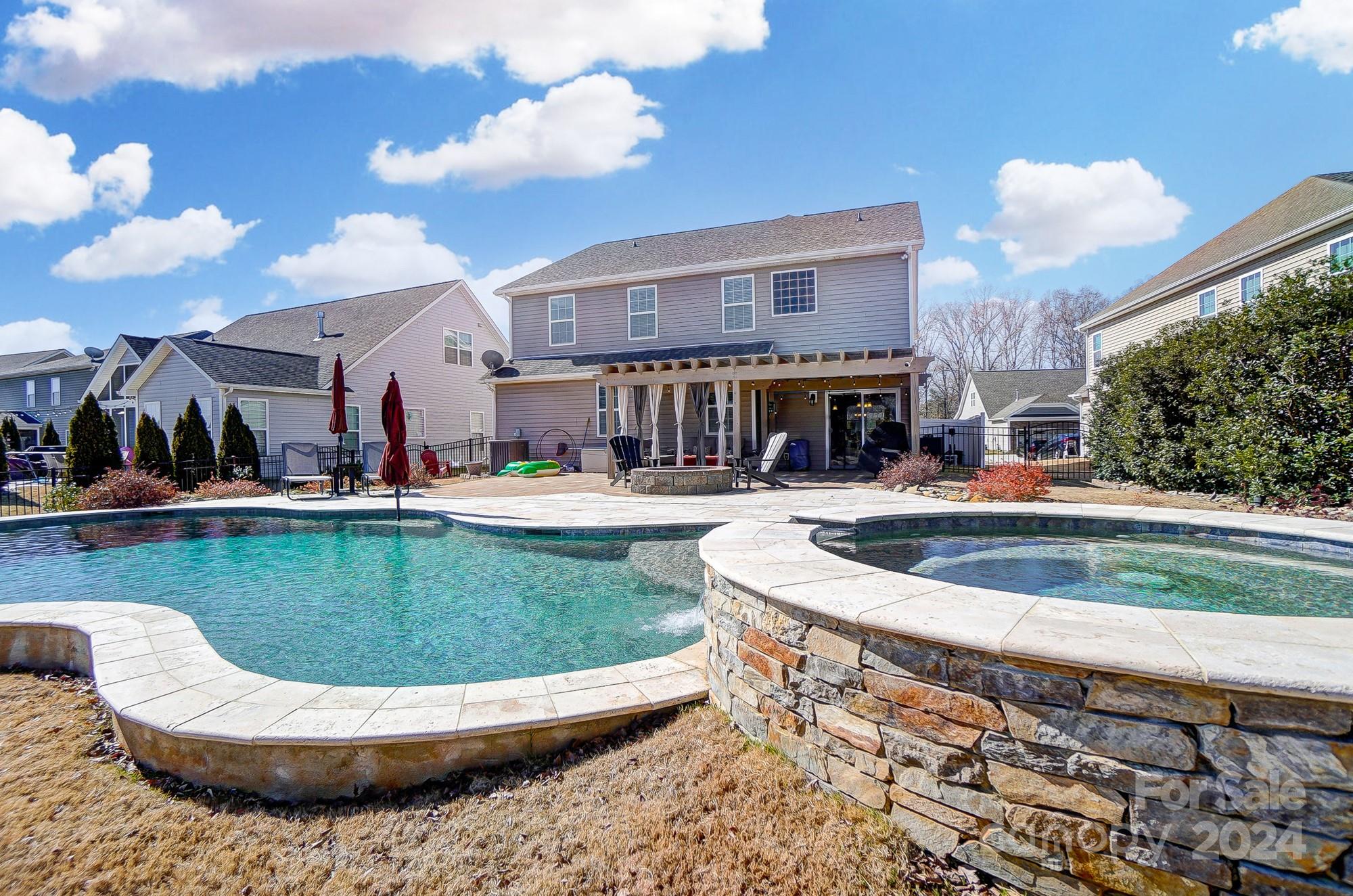 156 Annatto Way Tega Cay, SC 29708 - Photo 30 of 48 a view of a swimming pool with outdoor seating