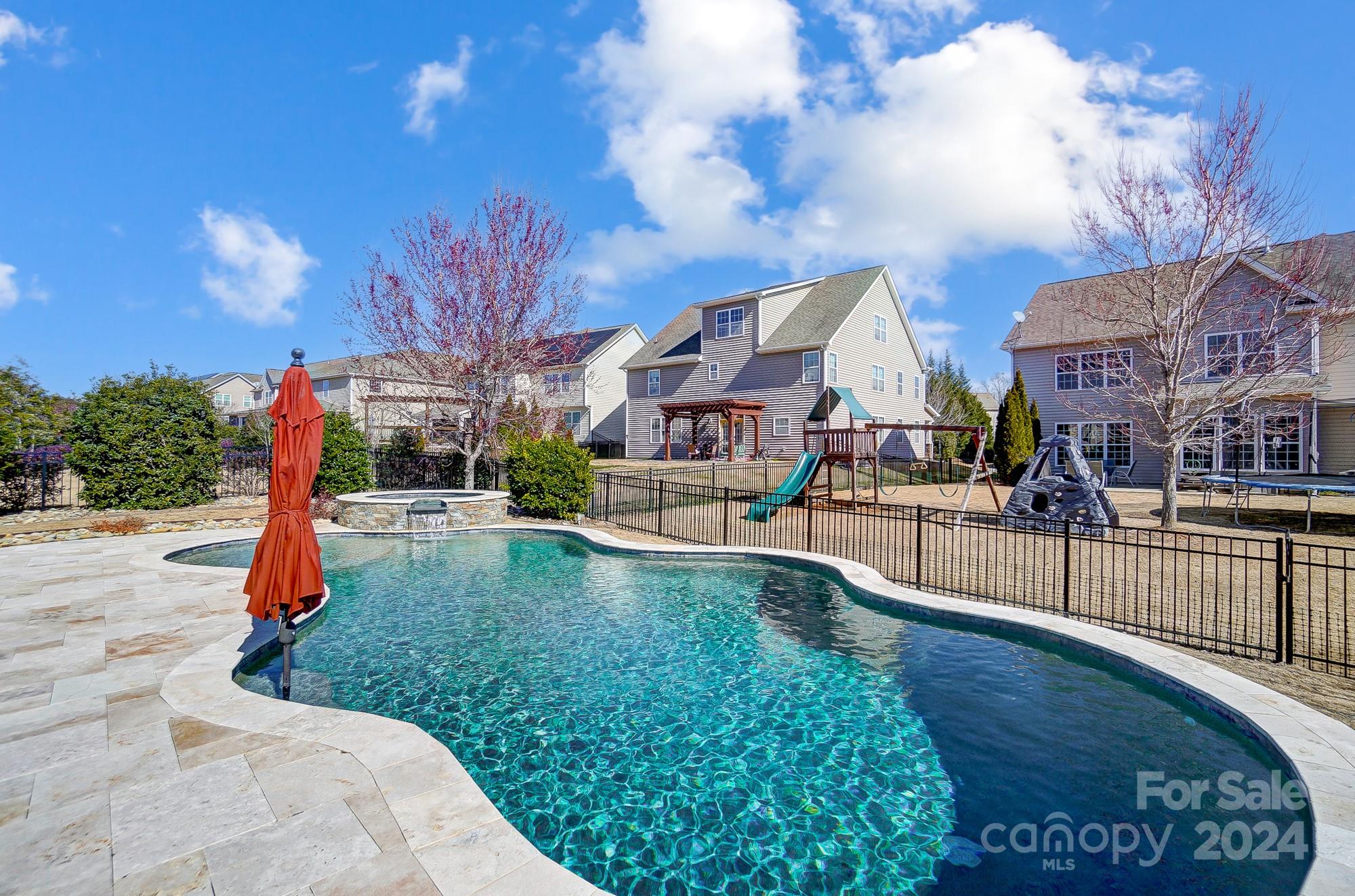 156 Annatto Way Tega Cay, SC 29708 - Photo 32 of 48 a view of the house with a swimming pool