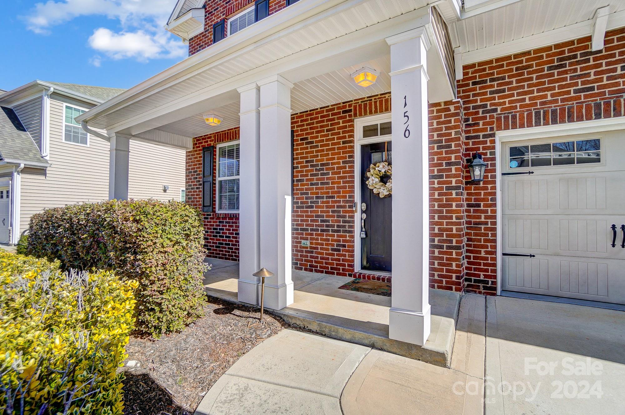 156 Annatto Way Tega Cay, SC 29708 - Photo 4 of 48 a house view with a outdoor space