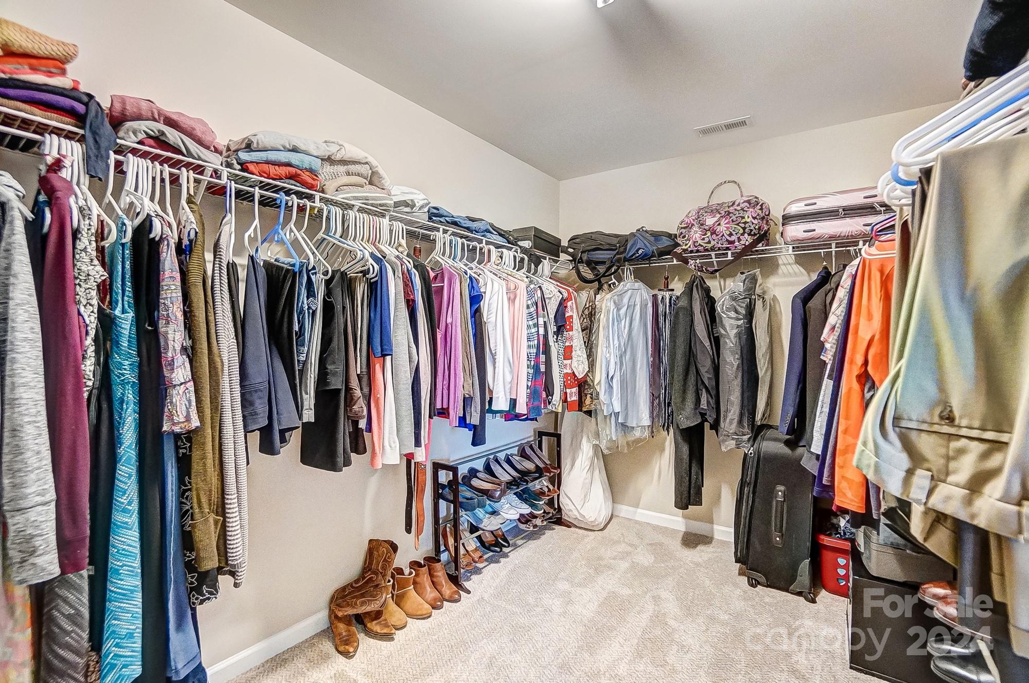 156 Annatto Way Tega Cay, SC 29708 - Photo 42 of 48 a view of walk in closet with clothes