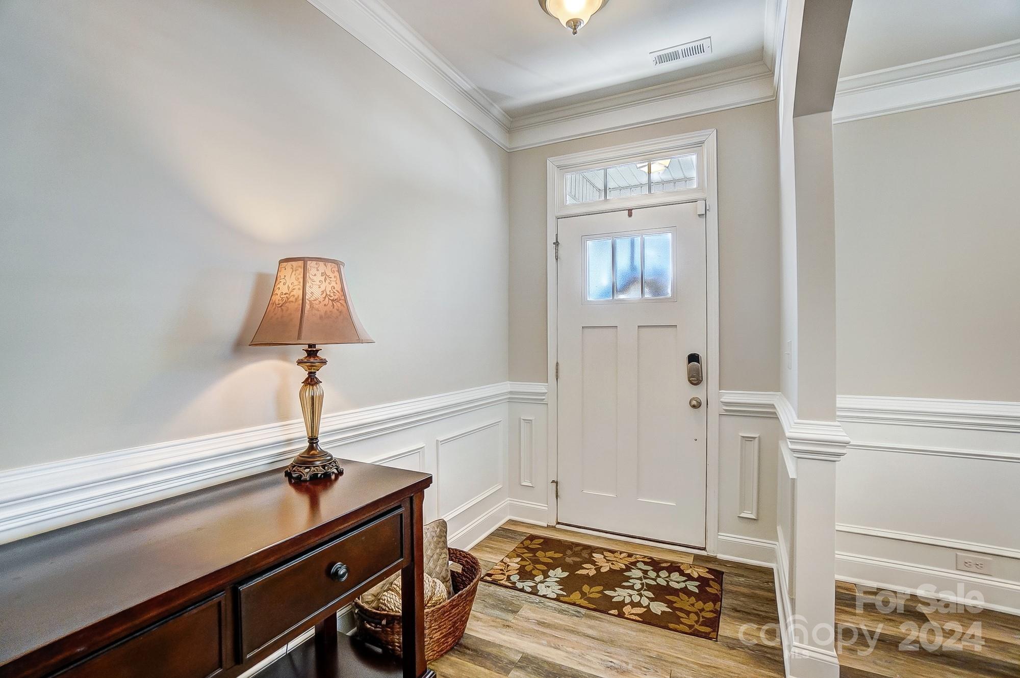 156 Annatto Way Tega Cay, SC 29708 - Photo 5 of 48 a view of an entryway with wooden floor