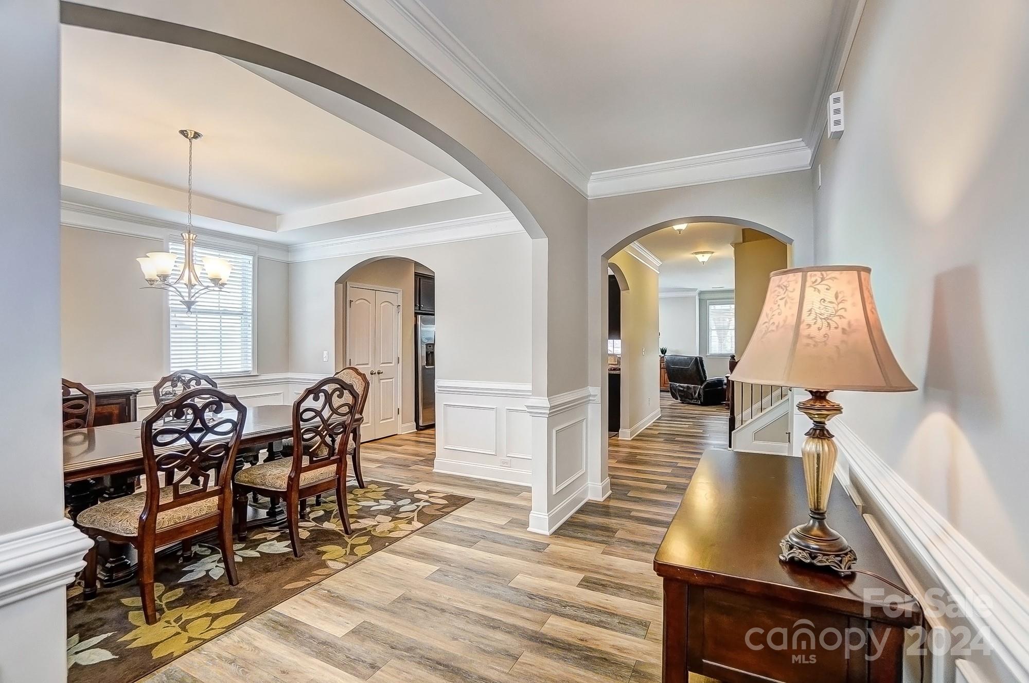 156 Annatto Way Tega Cay, SC 29708 - Photo 6 of 48 a view of a livingroom with furniture window and wooden floor