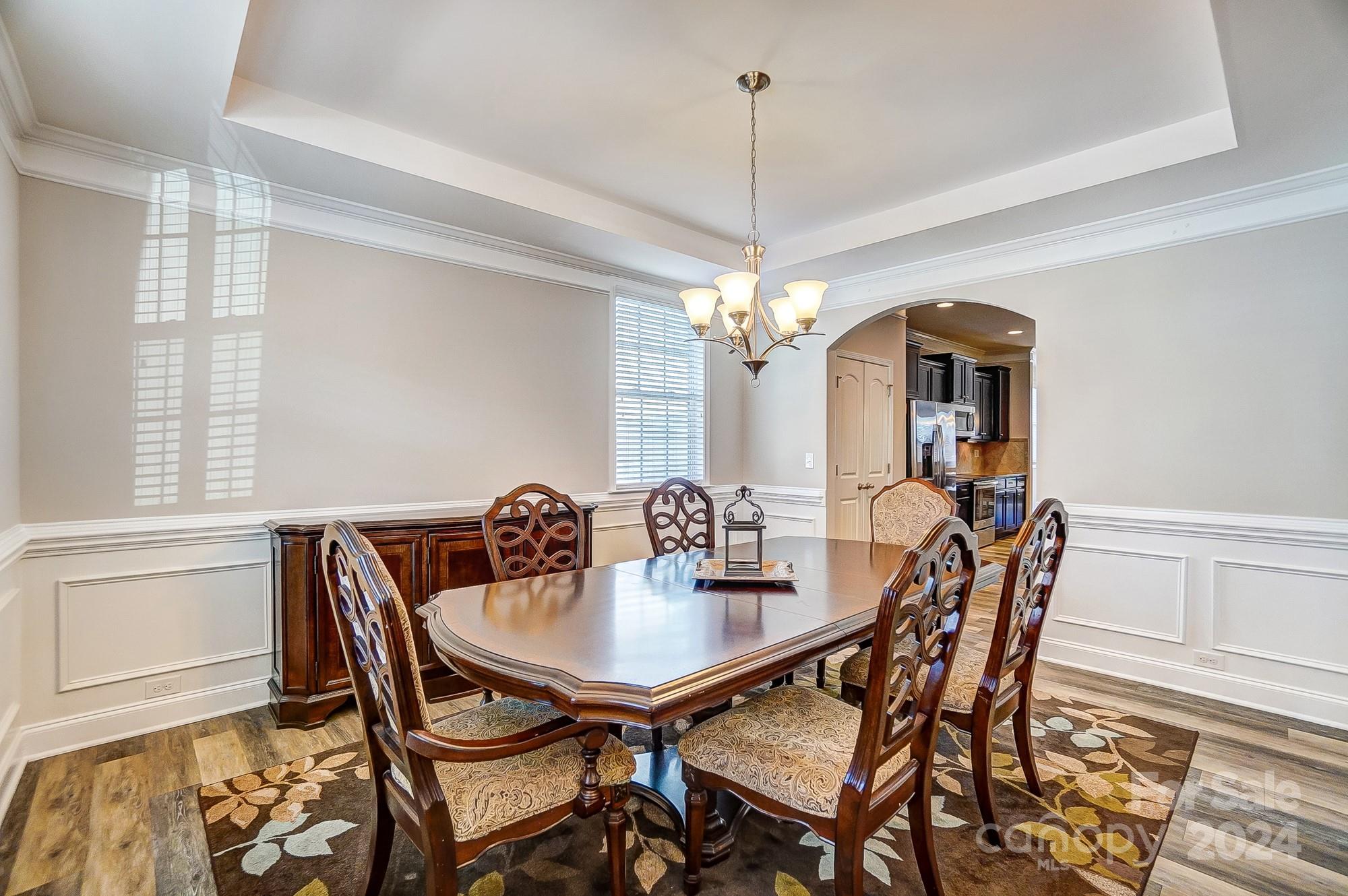 156 Annatto Way Tega Cay, SC 29708 - Photo 9 of 48 a view of a dining room with furniture and chandelier