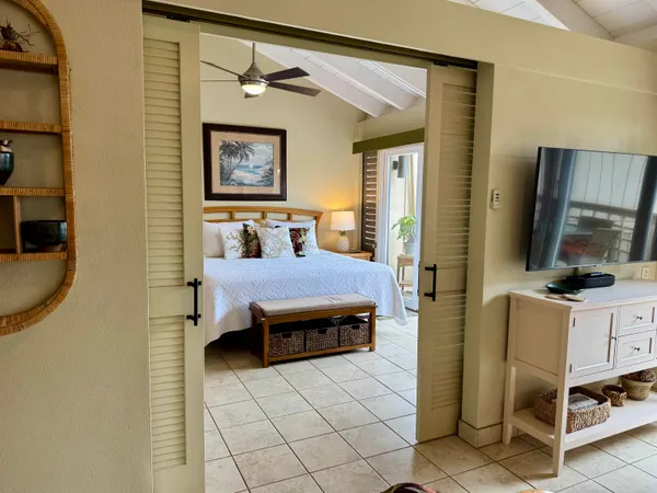 a bed room with furniture and window