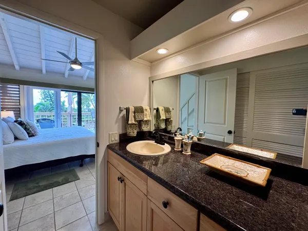 a bathroom with a shower and a sink