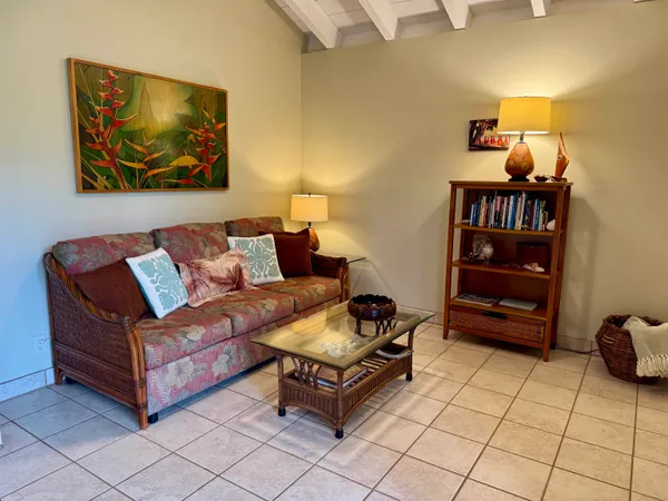 a living room with furniture and a rug