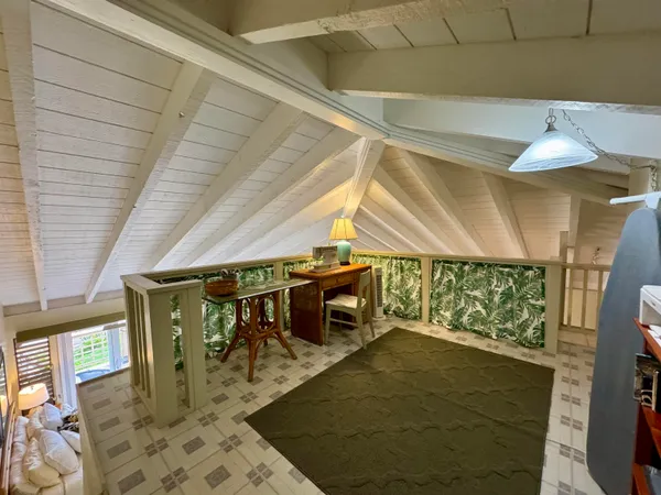 a room with furniture and a rug