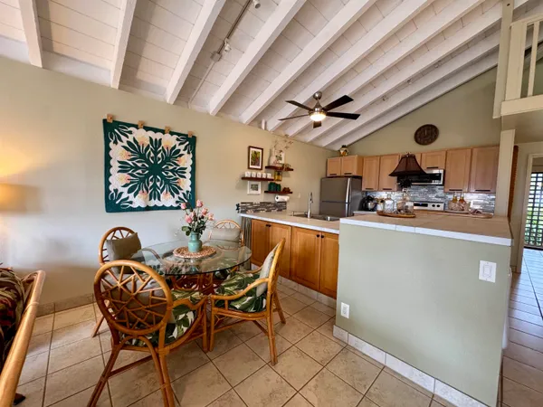 a kitchen with stainless steel appliances a stove a sink and a microwave