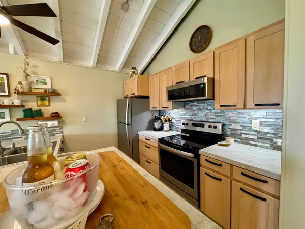 a kitchen with a sink and a stove