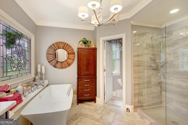 a living room with furniture a table and decor