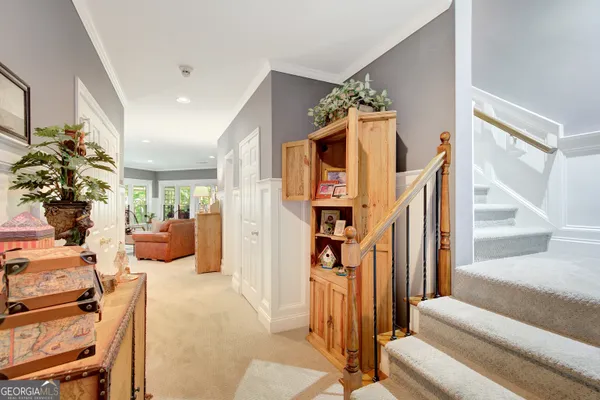 a living room with furniture a fireplace and a large mirror