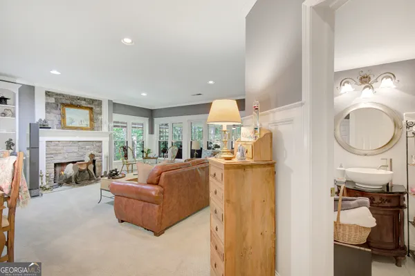 a bathroom with a toilet a sink and a mirror