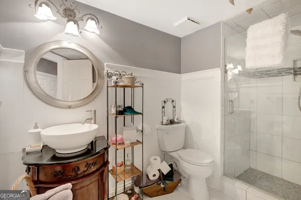 a living room with fireplace furniture and a flat screen tv