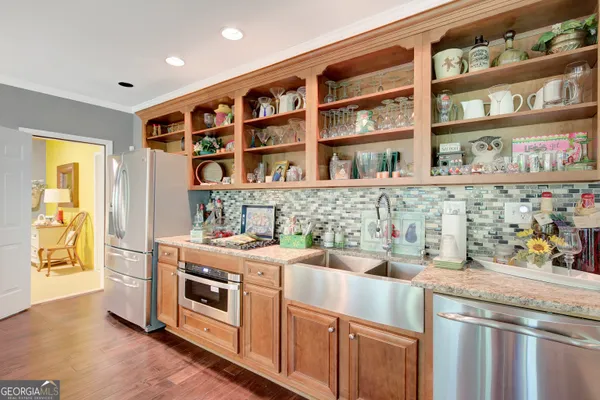 a view of a dining room with furniture and a window