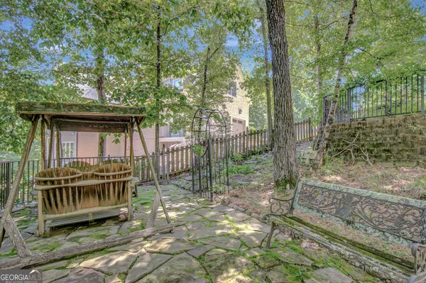 a house view with a garden and trees