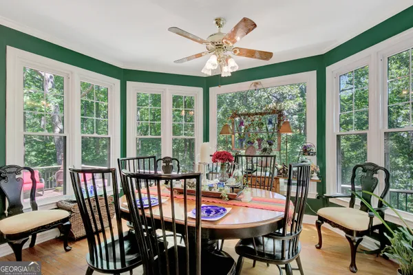 a view of a dining room with furniture window and outside view