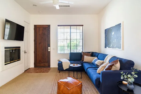 a living room with furniture and a flat screen tv