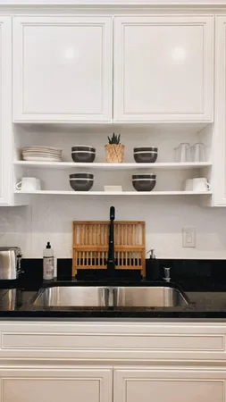 a kitchen with a refrigerator and cabinets