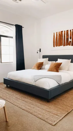 a bedroom with a bed and window
