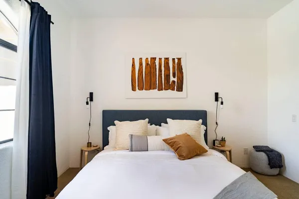 a bedroom with a bed and window