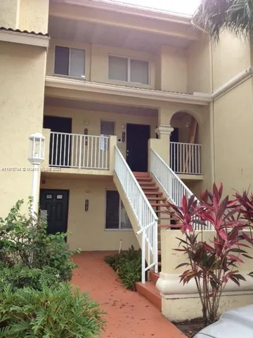 front view of a house with a small yard