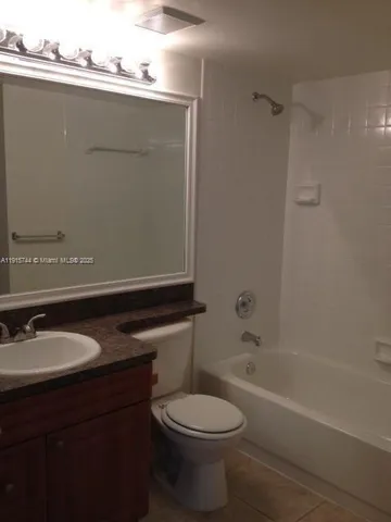 a bathroom with a sink a toilet and bathtub