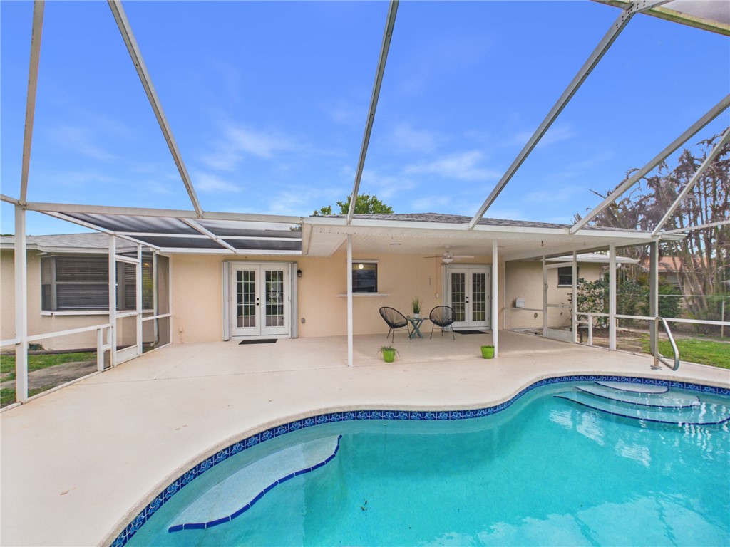 225 Midvale Terrace Sebastian, FL 32958 - Photo 24 of 25 a view of a house with swimming pool and porch