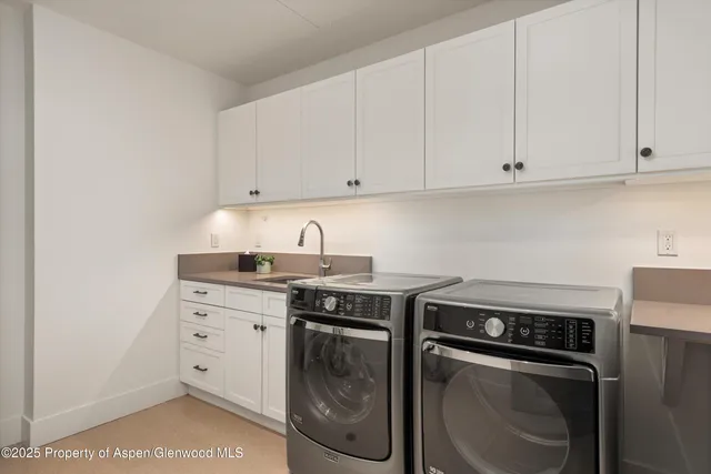 a kitchen with appliances and cabinets