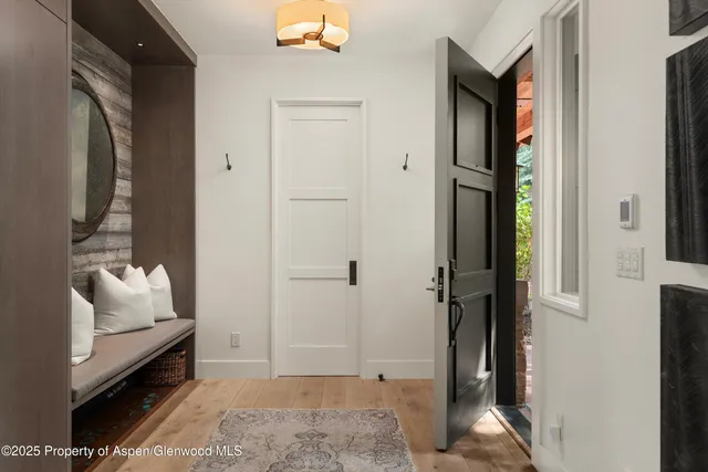 a room that has a bed and a mirror in it