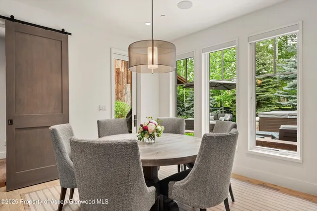 a dining room with furniture window wooden floor