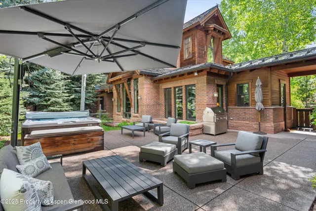 a patio with patio a couch and chairs