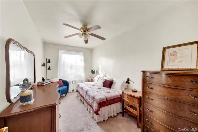 a bed room with a bed and a mirror