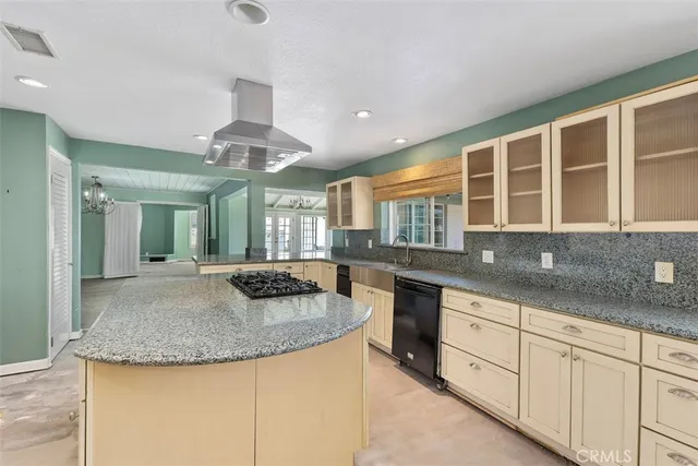 a view of a bedroom with a bed and furniture