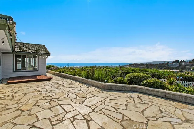 a view of a city with lush green forest