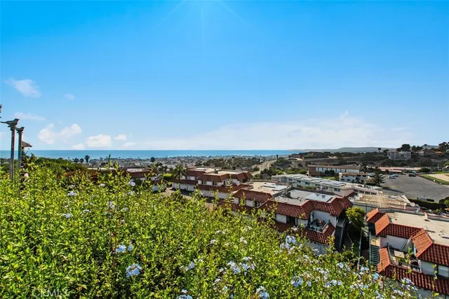 a view of a city with tall buildings in ocean view