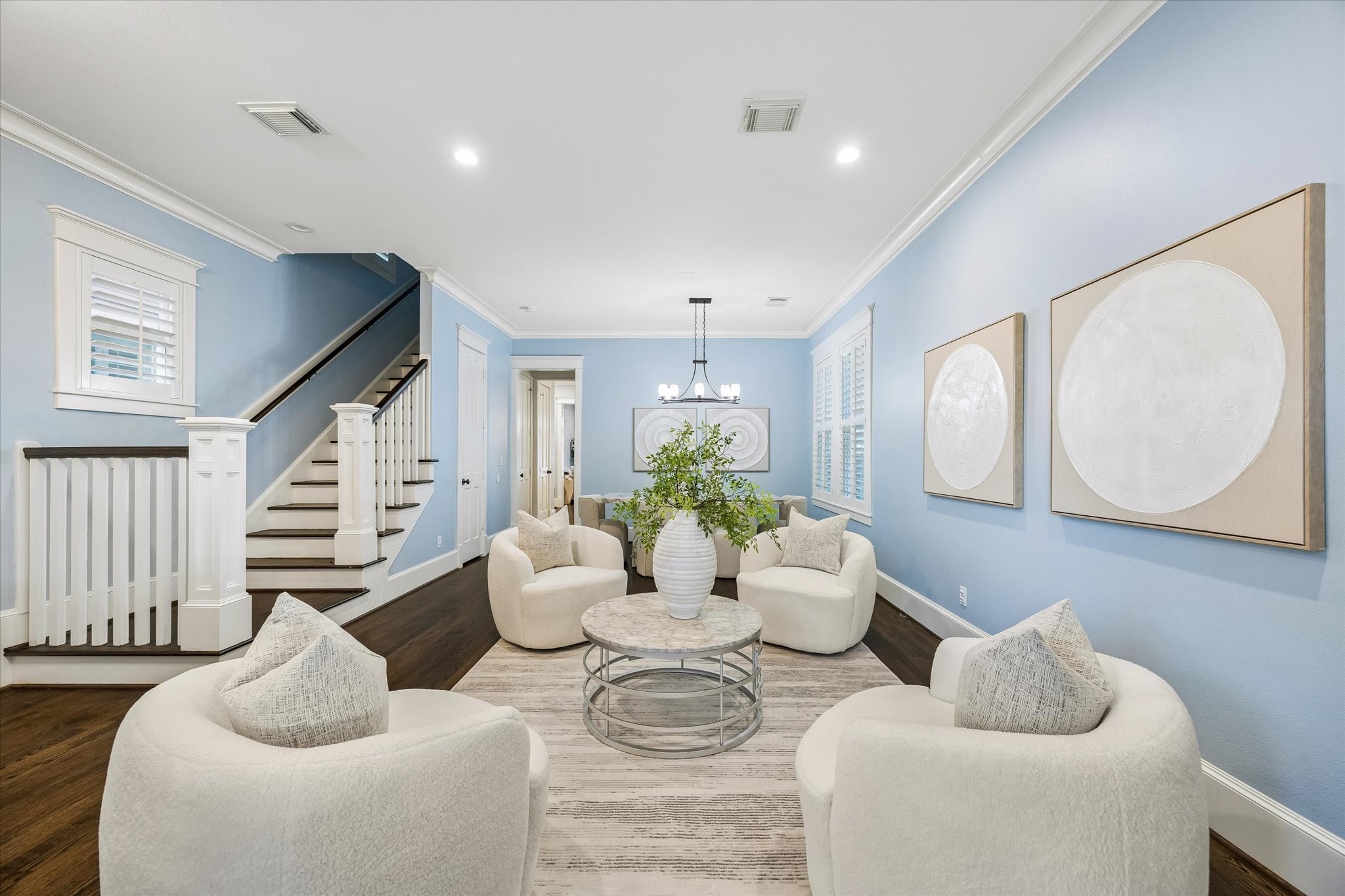 634 West 17th Street Houston, TX 77008 - Photo 7 of 42 Elegant and easy to love, this formal living area blends soft neutral finishes, rich wood flooring, and timeless millwork for a look that feels both classic and fresh.