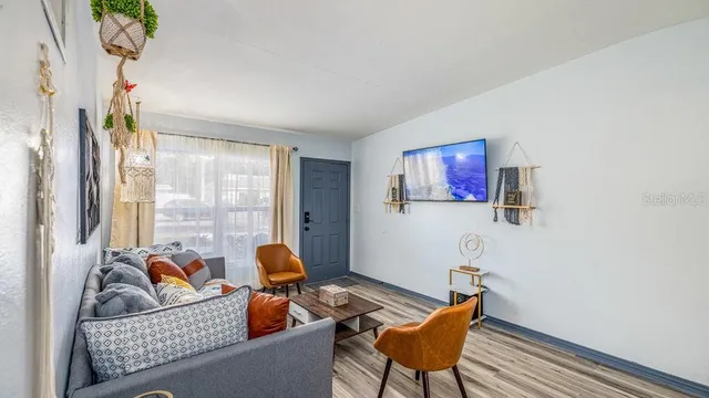 a living room with furniture and a window