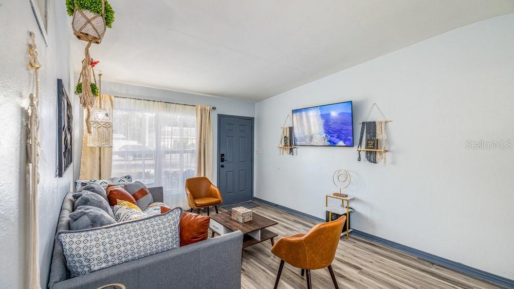 1406 South Conway Road Orlando, FL 32812 - Photo 11 of 30 a living room with furniture and a window