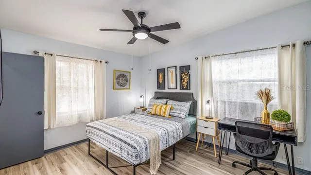 a bedroom with a bed and a window