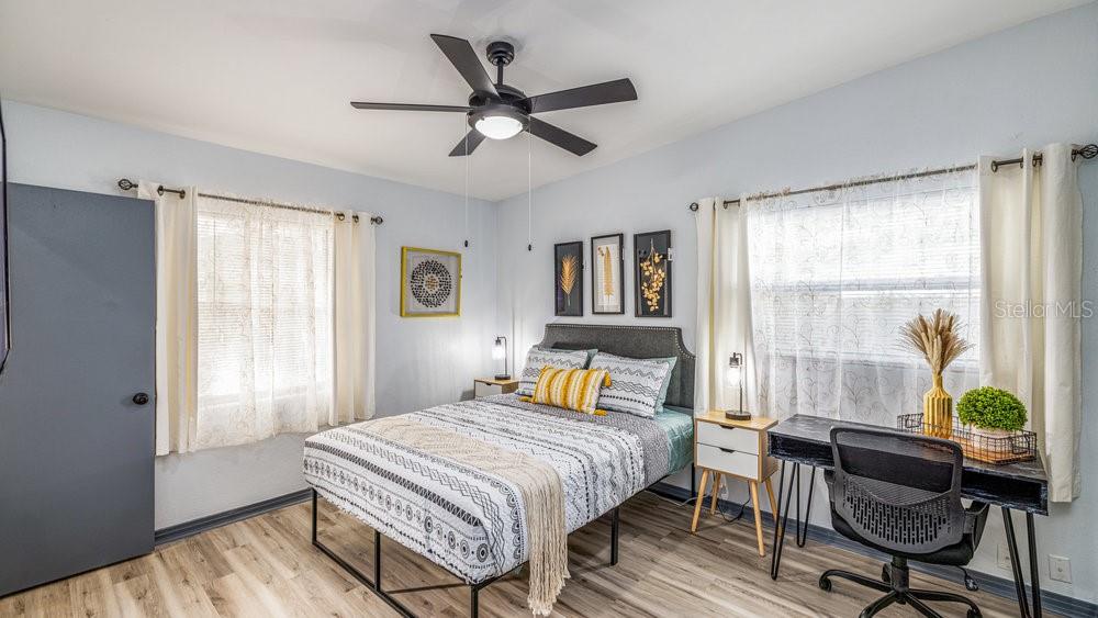 1406 South Conway Road Orlando, FL 32812 - Photo 27 of 30 a bedroom with a bed and a window