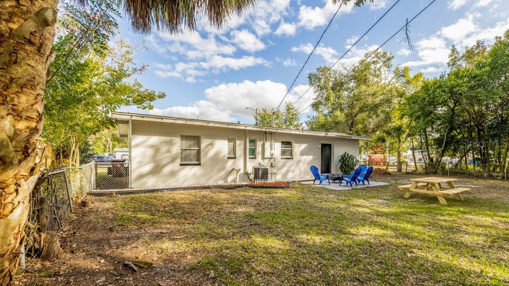 1406 South Conway Road Orlando, FL 32812 - Photo 29 of 30 a view of a house with a big yard and large tree