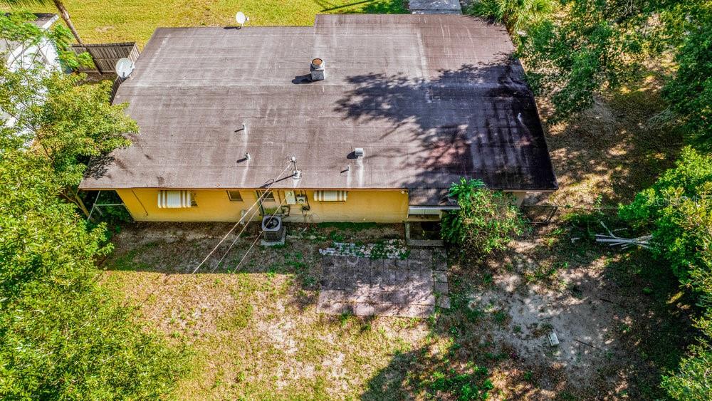 1406 South Conway Road Orlando, FL 32812 - Photo 6 of 30 an aerial view of a house with a yard and large tree